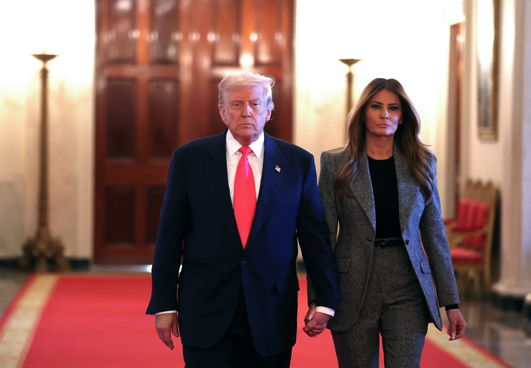 President Donald Trump and first lady Melania Trump arrive for the signing ceremony for the 