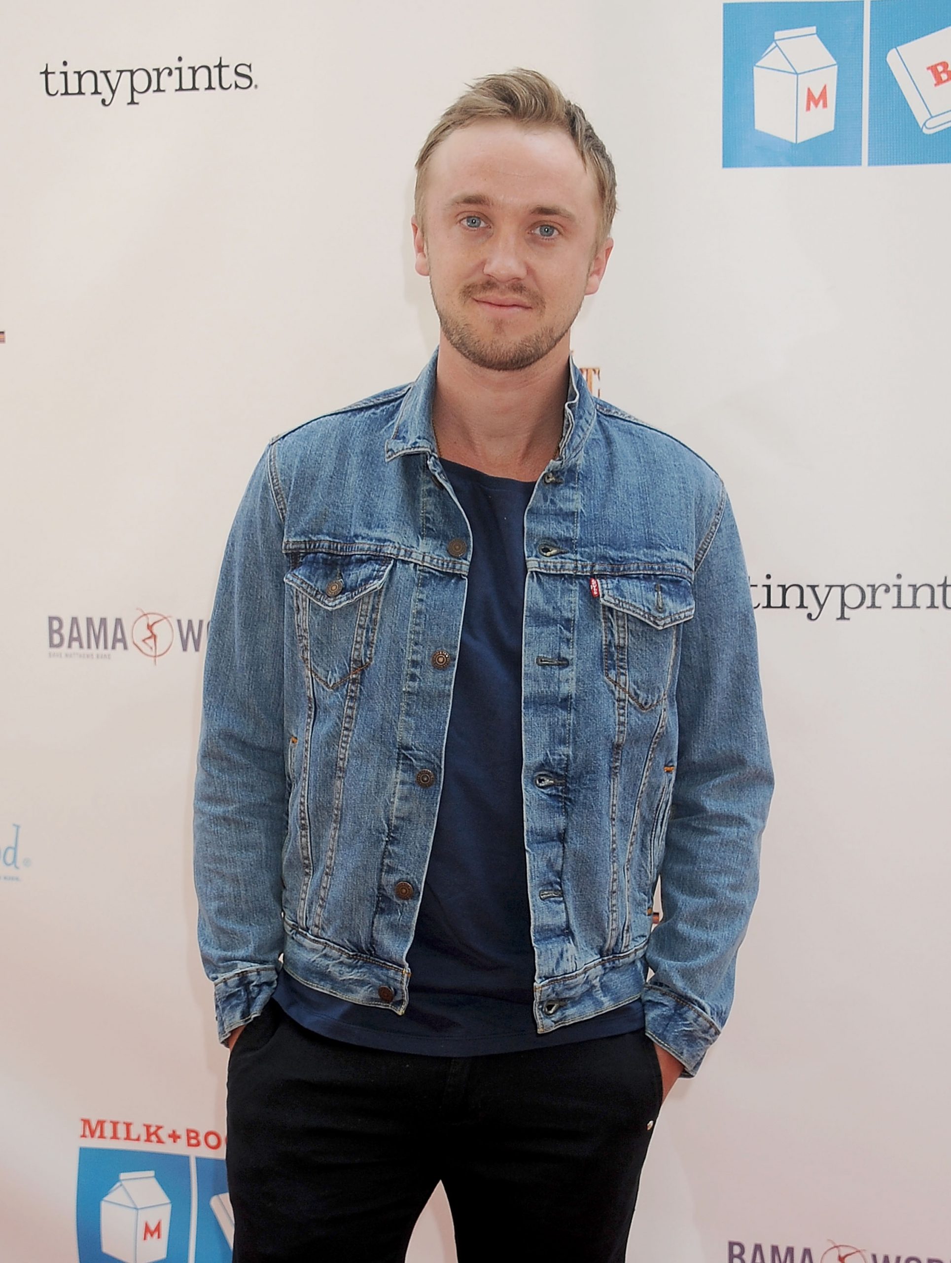 Stepping out in a relaxed denim look, bringing easy charm to the Milk + Bookies 6th Annual Story Time Celebration's cheerful atmosphere, Tom Felton's casual confidence pairs effortlessly with the playful, kid-friendly spirit of the event. At the function, he blends star power with a down-to-earth warmth.