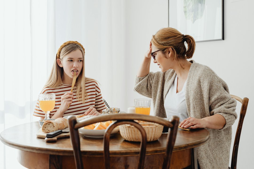 An annoyed young girl with her mother | Source: Pexels