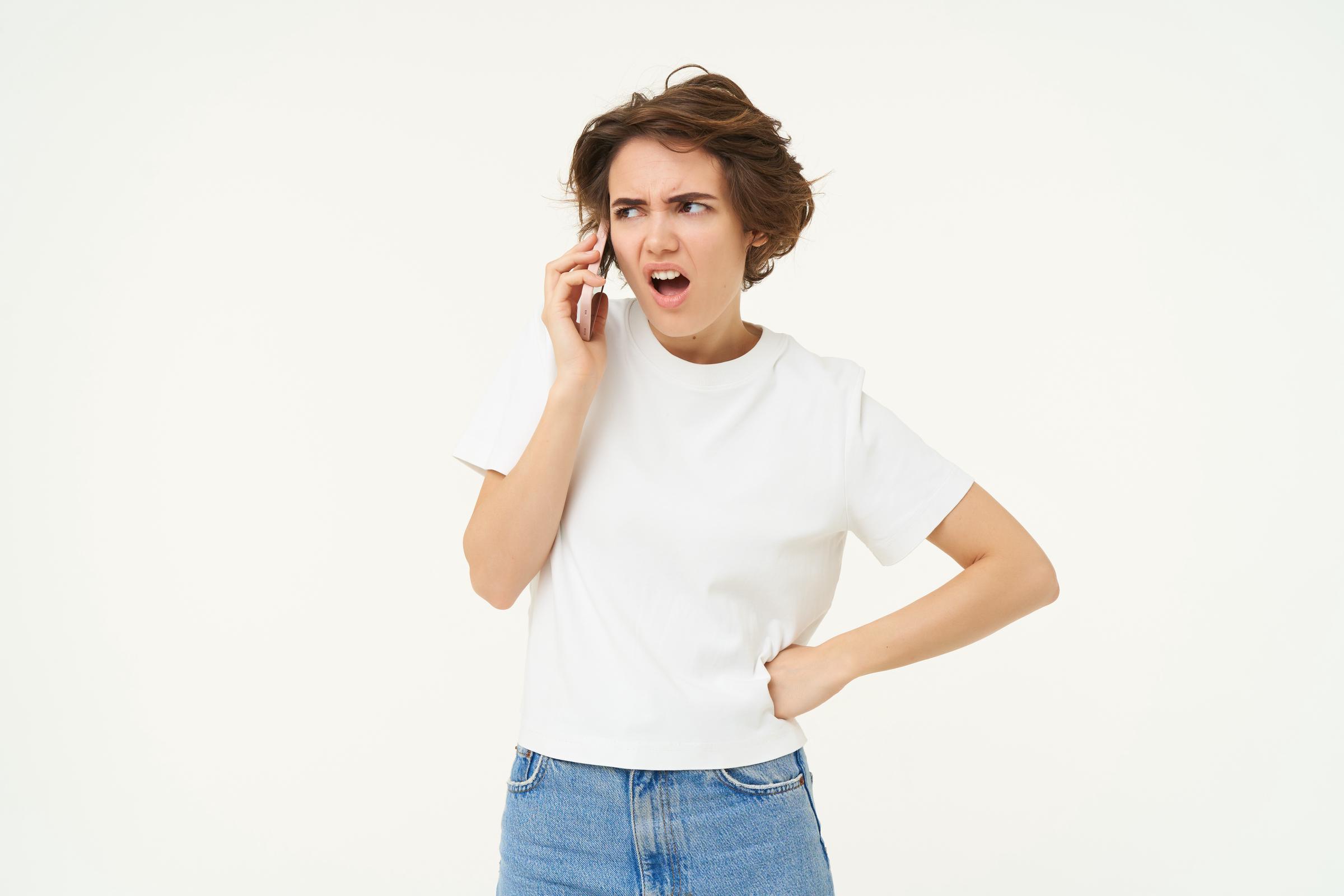An angry woman on a call | Source: Freepik