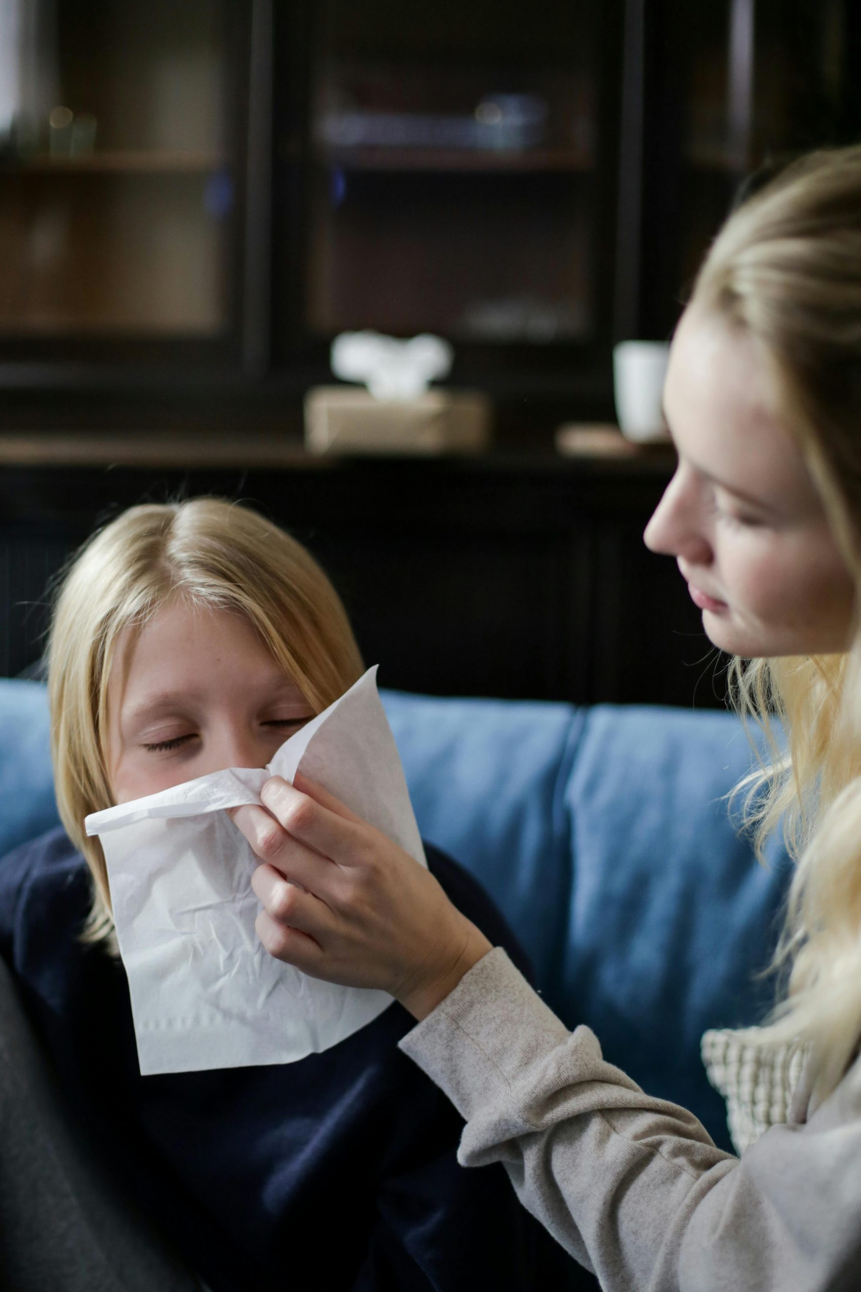 A mother nursing her sick daughter | Source: Pexels