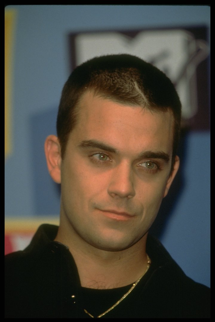 Robbie Williams attended the Europe Music Awards in Milan, Italy, in 1998, sporting a close-cropped haircut and a confident stare. By then, his solo career was in full swing, and his edgy new look reflected a star stepping firmly into his own spotlight.