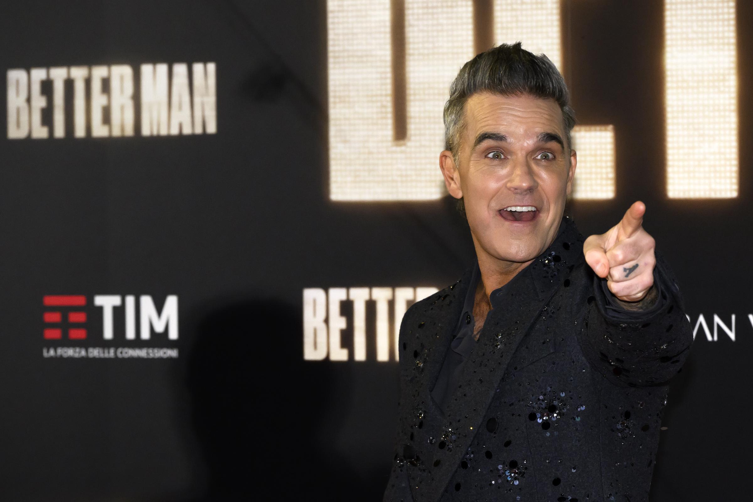 Robbie Williams appeared on the red carpet for the film