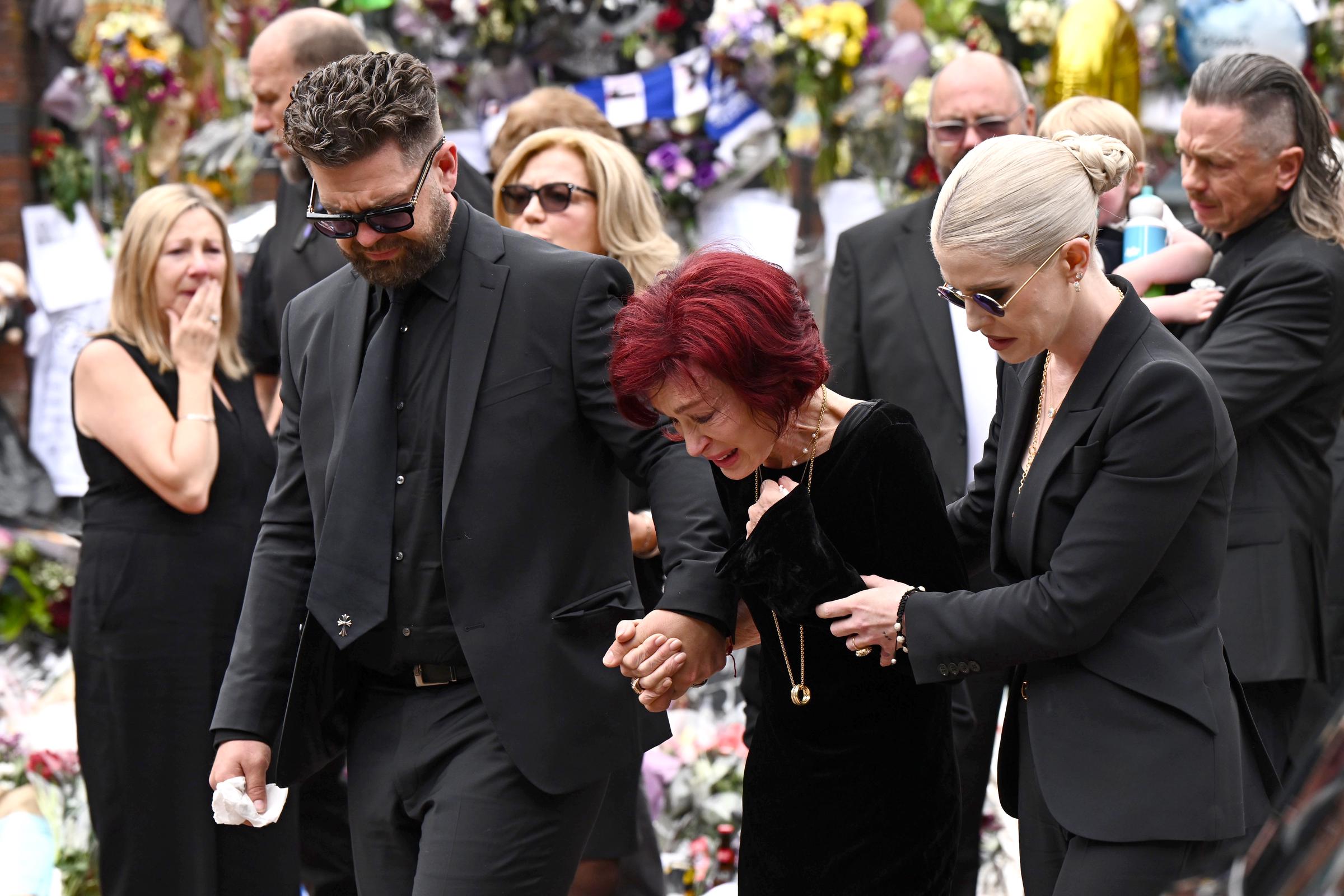 Jack, Sharon, and Kelly Osbourne during Ozzy Osbourne's funeral on July 30, 2025, in Birmingham, England. | Source: Getty Images