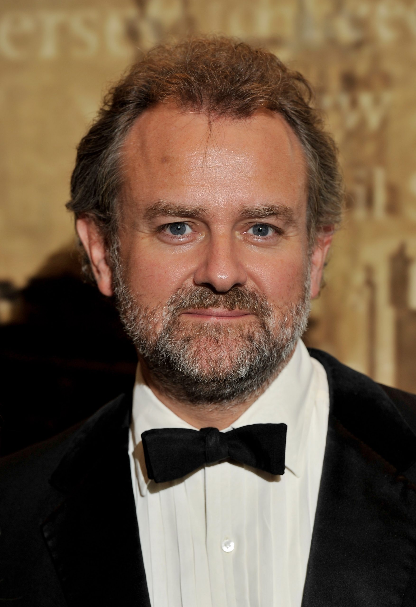 Hugh Bonneville stepped out at The Specsavers Crime Thriller Awards in 2010 with a full salt-and-pepper beard and tousled hair, embracing a more rugged, understated look that echoed the early days of his role as Lord Grantham on