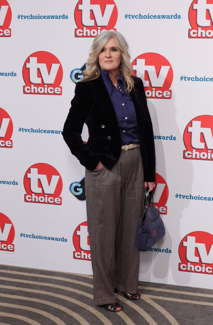 At the TV Choice Awards in 2025, Finneran stepped out with striking silver-blonde waves and a polished, modern ensemble. Her tailored velvet blazer, pinstriped shirt, and wide-leg trousers signaled a confident evolution in style, reflecting her continued presence in British television more than a decade after her Downton days.