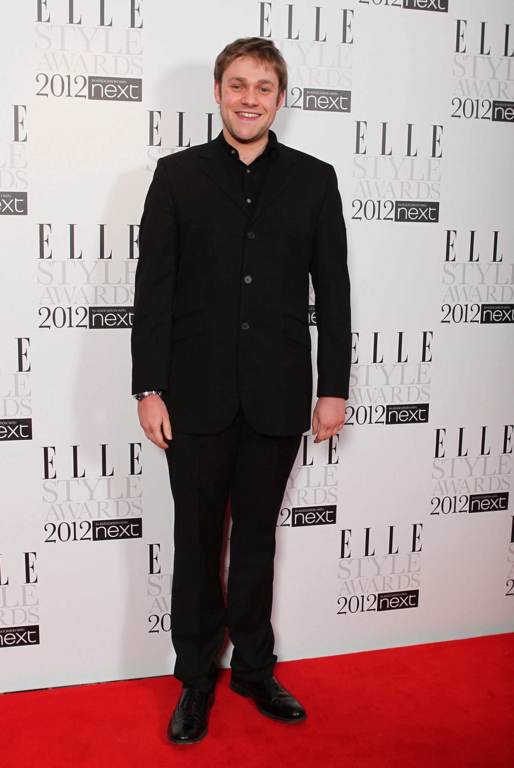 Thomas Howes hit the red carpet at the ELLE Style Awards in 2012 with a youthful energy and clean-cut look. Dressed in an all-black suit and shirt, he kept things simple and relaxed while enjoying the spotlight during the early days of his