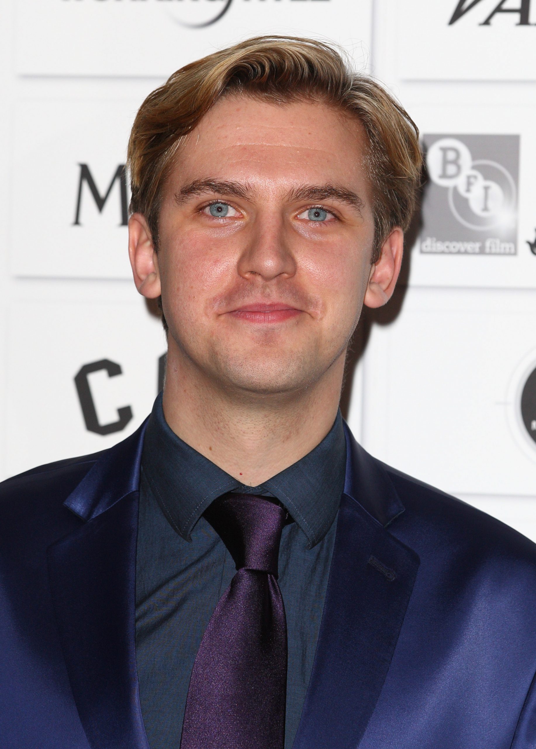 Dan Stevens attended the 2011 Moet British Independent Film Awards with a clean-cut look, sporting a navy suit, dark shirt, and matching tie. With his neatly combed blonde hair and polished style, he looked every bit the rising star freshly launched into the spotlight by