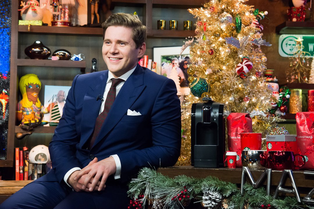 Allen Leech appeared on Watch What Happens Live in 2013 looking sharp in a navy suit and burgundy tie, with a crisp white pocket square adding a classic touch. His neatly styled hair and easy smile reflected the affable charm of his