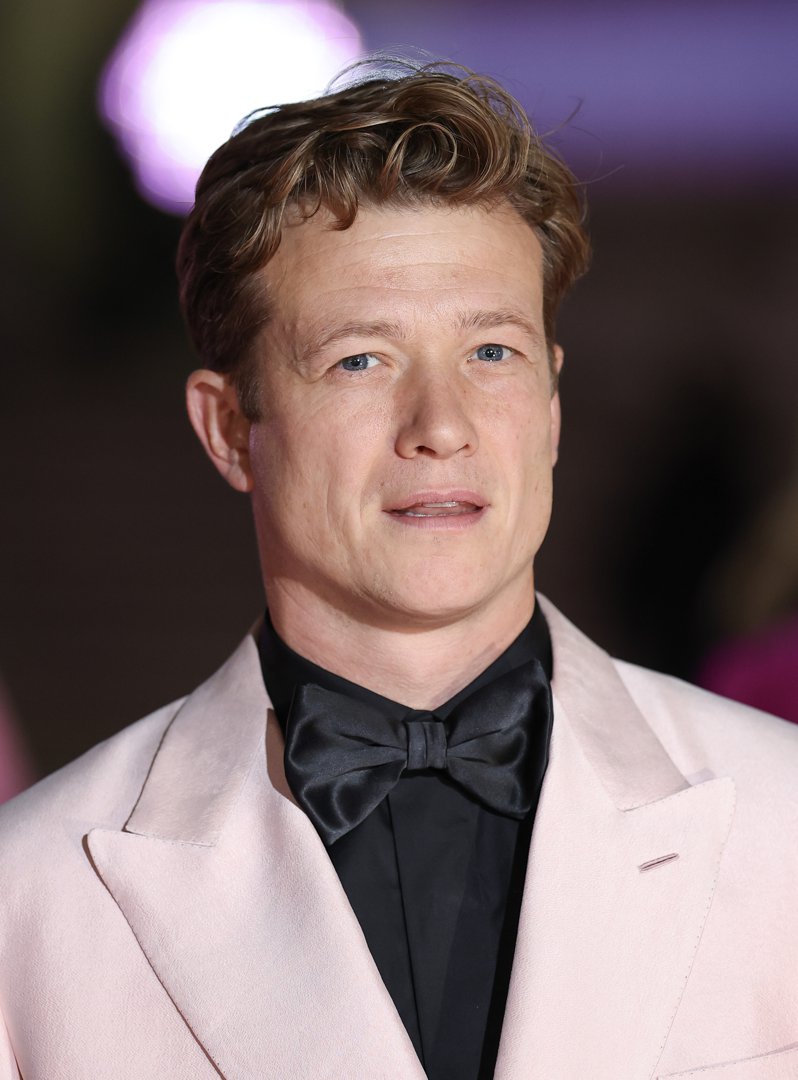 At the inaugural British Museum Ball in 2025, Speleers embraced a sharper edge, wearing a blush pink tuxedo jacket paired with a black shirt and oversized bow tie. With a more chiseled look and confident presence, he showcased the evolution from young heartthrob to seasoned actor.