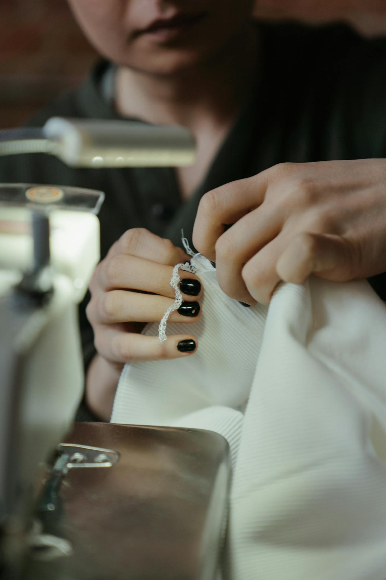 A woman sewing a dress | Source: Pexels