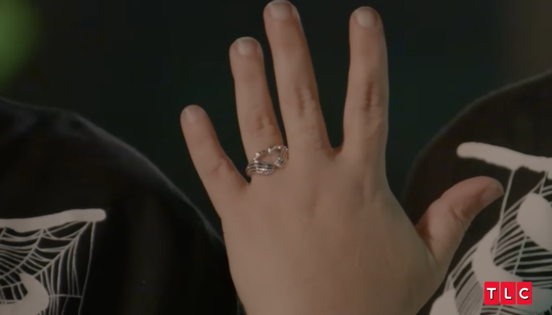 A close-up of Amy Slaton's skull-themed engagement ring, featuring skeletal fingers forming a heart, as posted on July 7, 2025 | Source: YouTube/TLC
