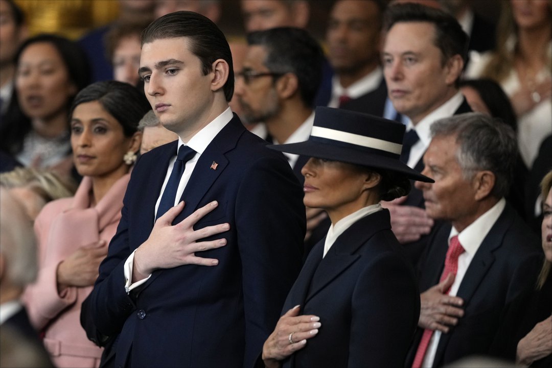 Barron Trump and Melania Trump listen to Christopher Macchio sing at the inauguration of Donald Trump on January 20, 2025 in Washington, DC. | Source: Getty Images