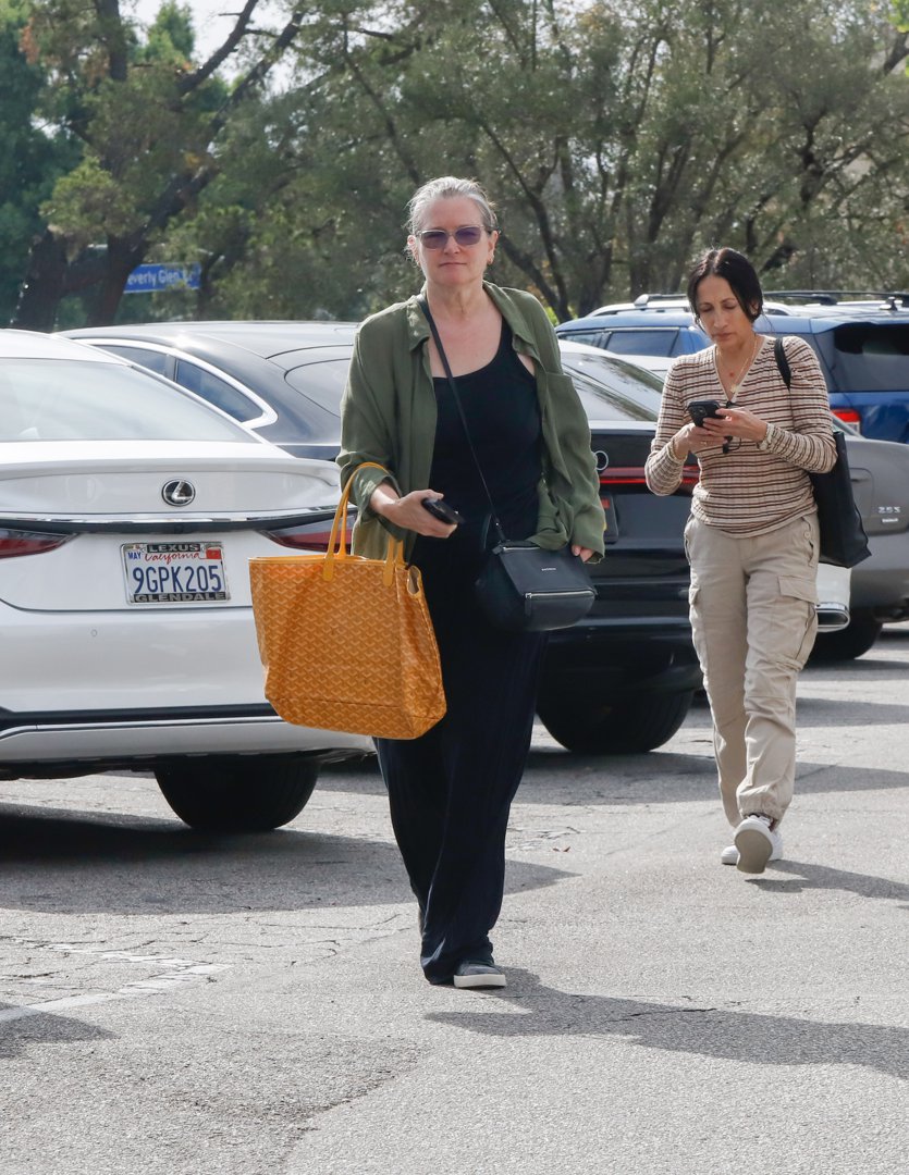 Still out in Los Angeles that day, Fonda carried a large woven orange tote and kept her hands full with a phone and wallet. With her silver-streaked hair pulled back and minimal makeup, she embraced a no-fuss, everyday look.
