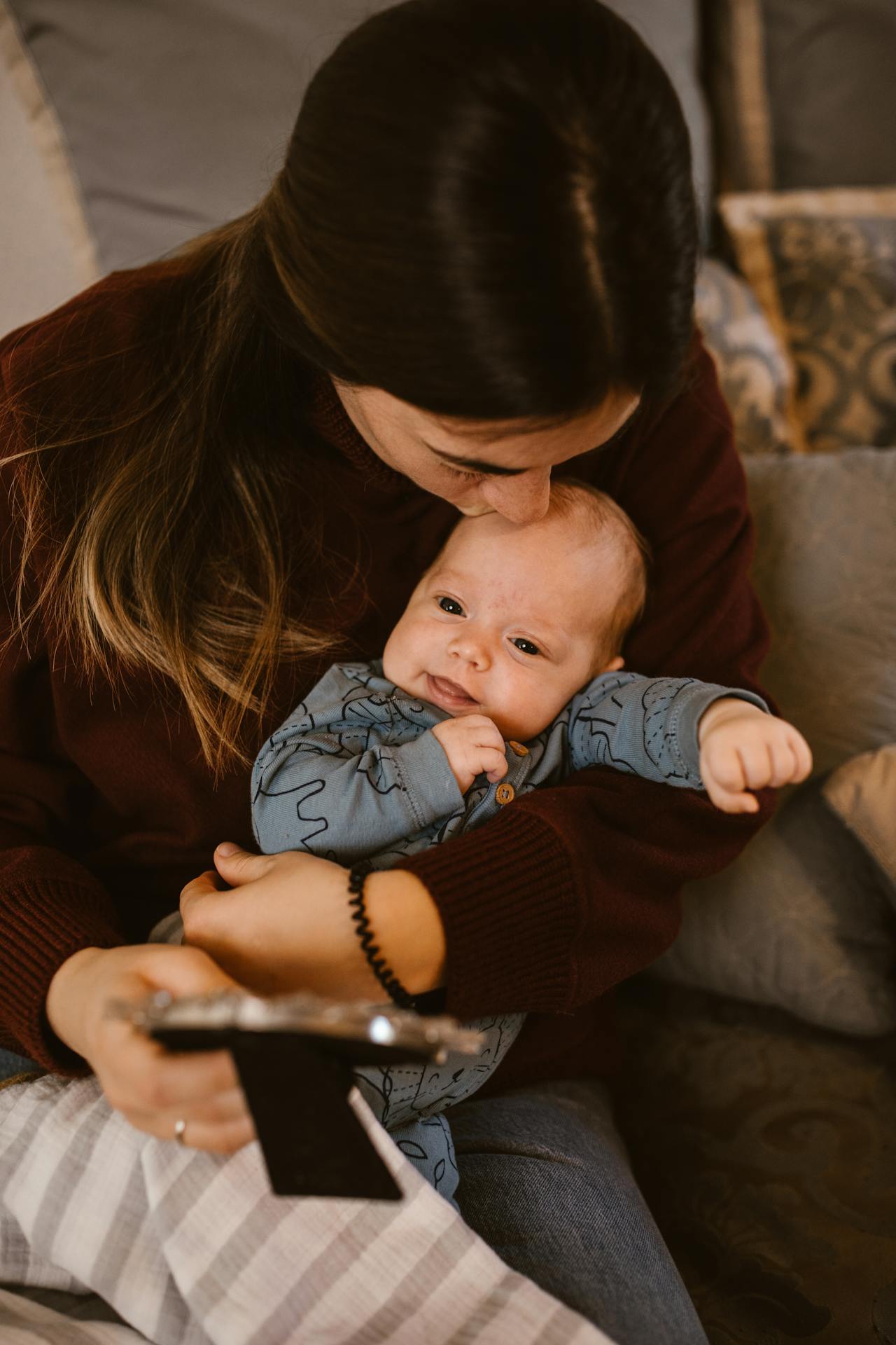 A mother kissing her baby | Source: Pexels