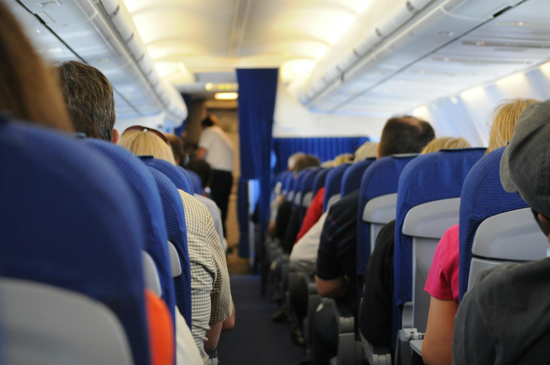 Passengers seated on an airplane | Source: Pexels