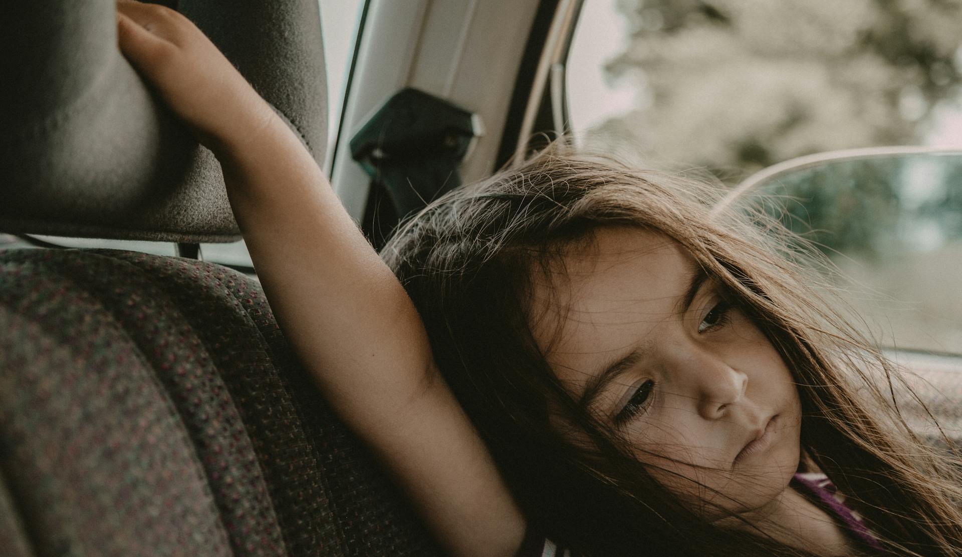 A girl in a car | Source: Pexels