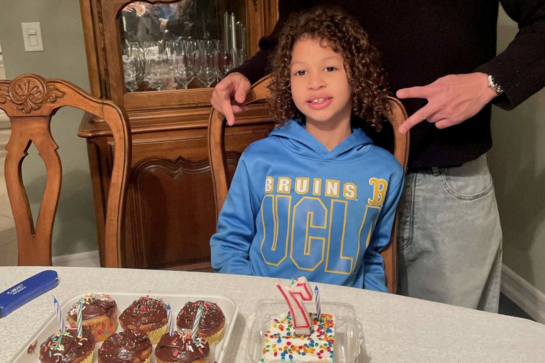 Lamar McGlothurn at home, smiling next to his birthday cupcakes | Source: State of California