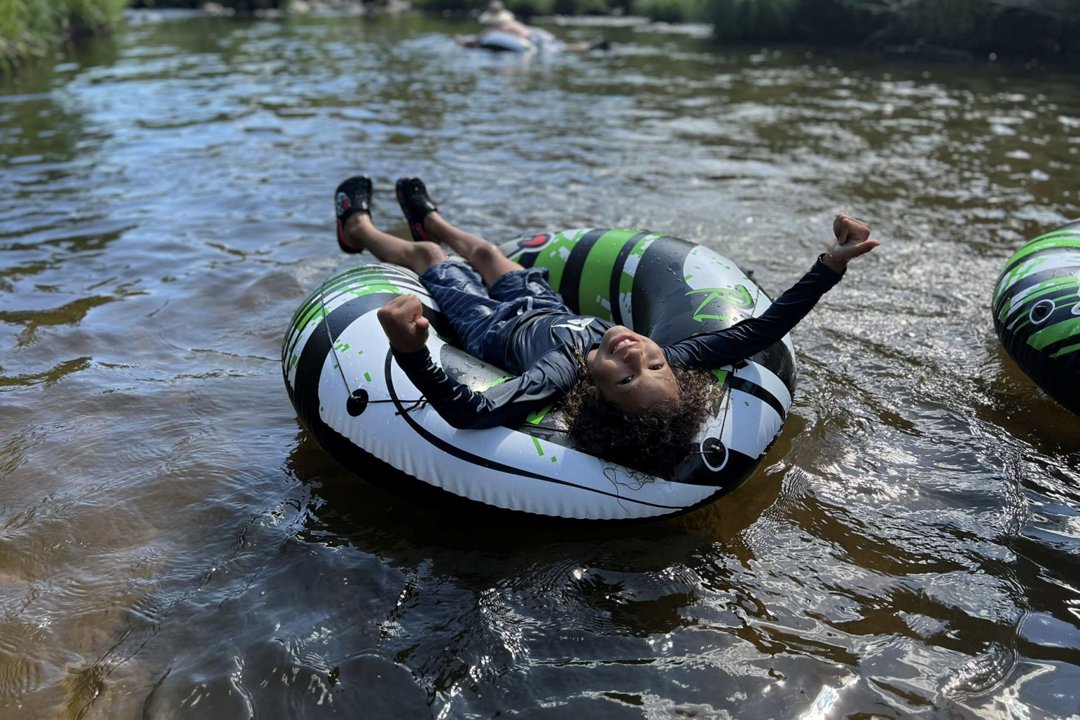 Lamar McGlothurn is shown floating in a river, enjoying a summer day in an inflatable tube | Source: State of California