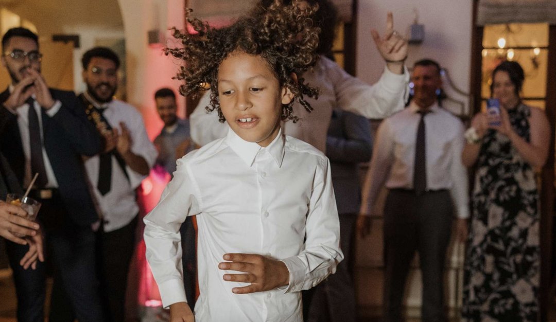Lamar McGlothurn dancing at a celebration, surrounded by family and friends | Source: State of California