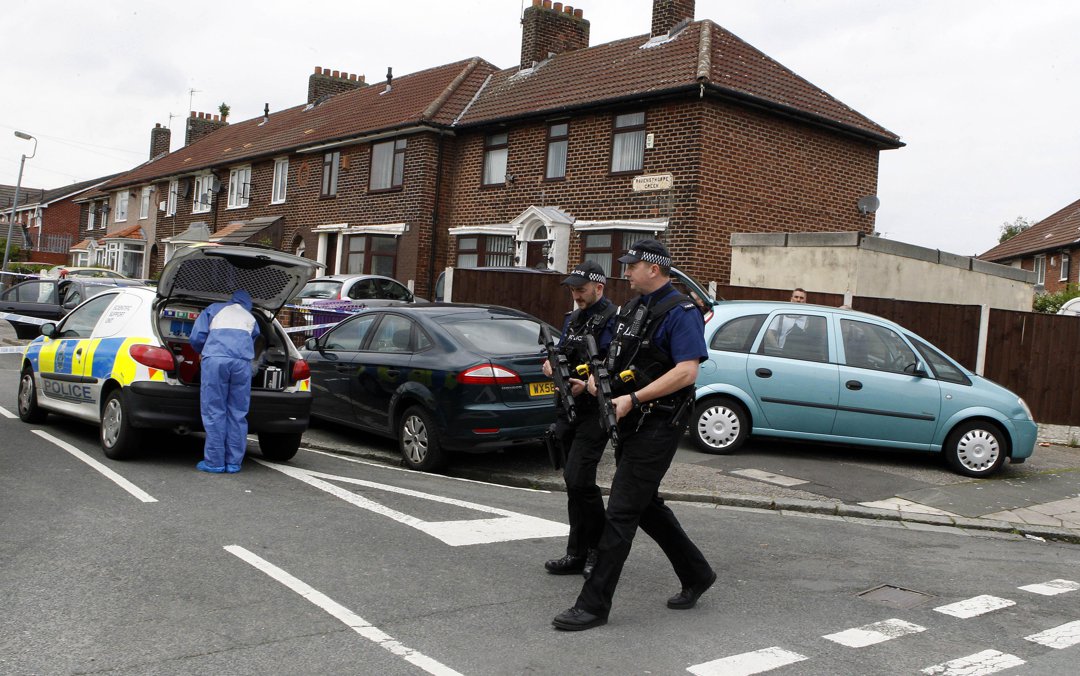 Armed police attend the scene in the Norris Green area of Liverpool. | Source: Getty Images