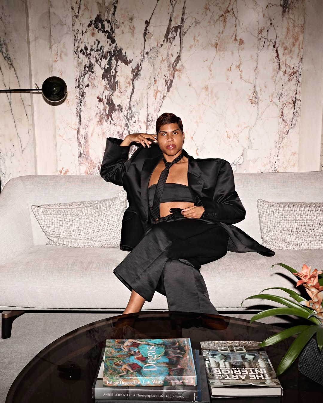 Centered and composed, EJ strikes a frontal pose that commands attention. With his hand raised near his face, the look is poised and deliberate — classic with an edge. | Source: Instagram/ejjohnson_