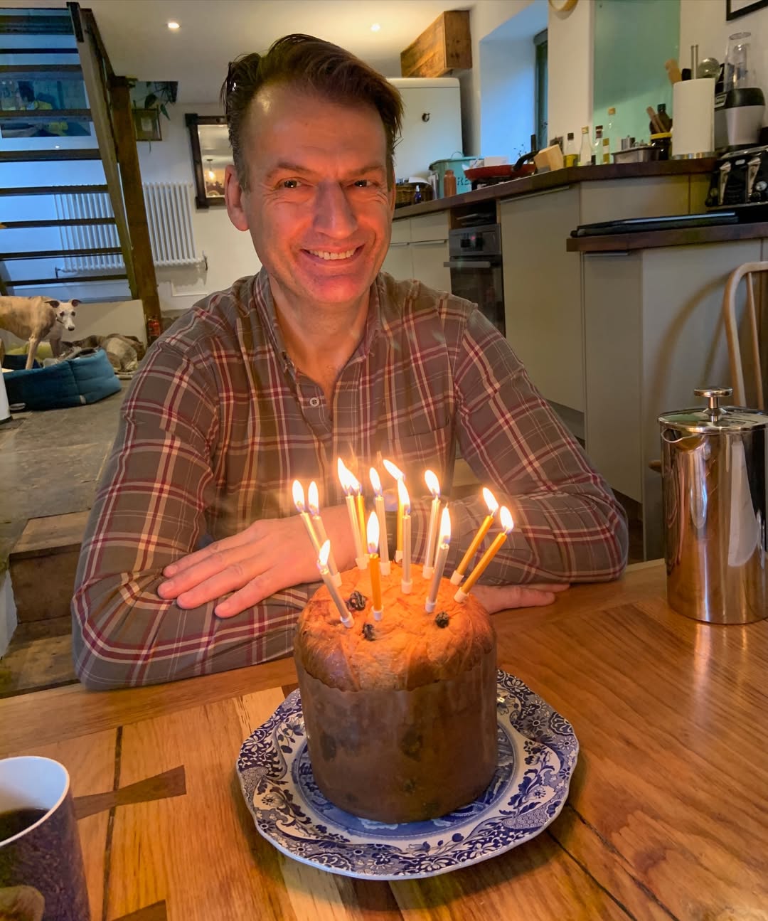 A candlelit smile. Surrounded by warmth and love, Simon beams behind a homemade birthday cake — each flame a flicker of joy, each year a gift. | Source: Instagram/douglasbooth