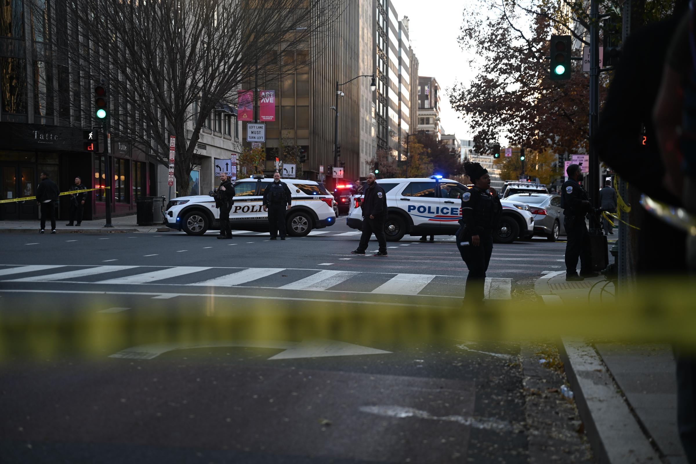 Police officers secure an intersection in downtown D.C, on November 26, 2025 | Source: Getty Images