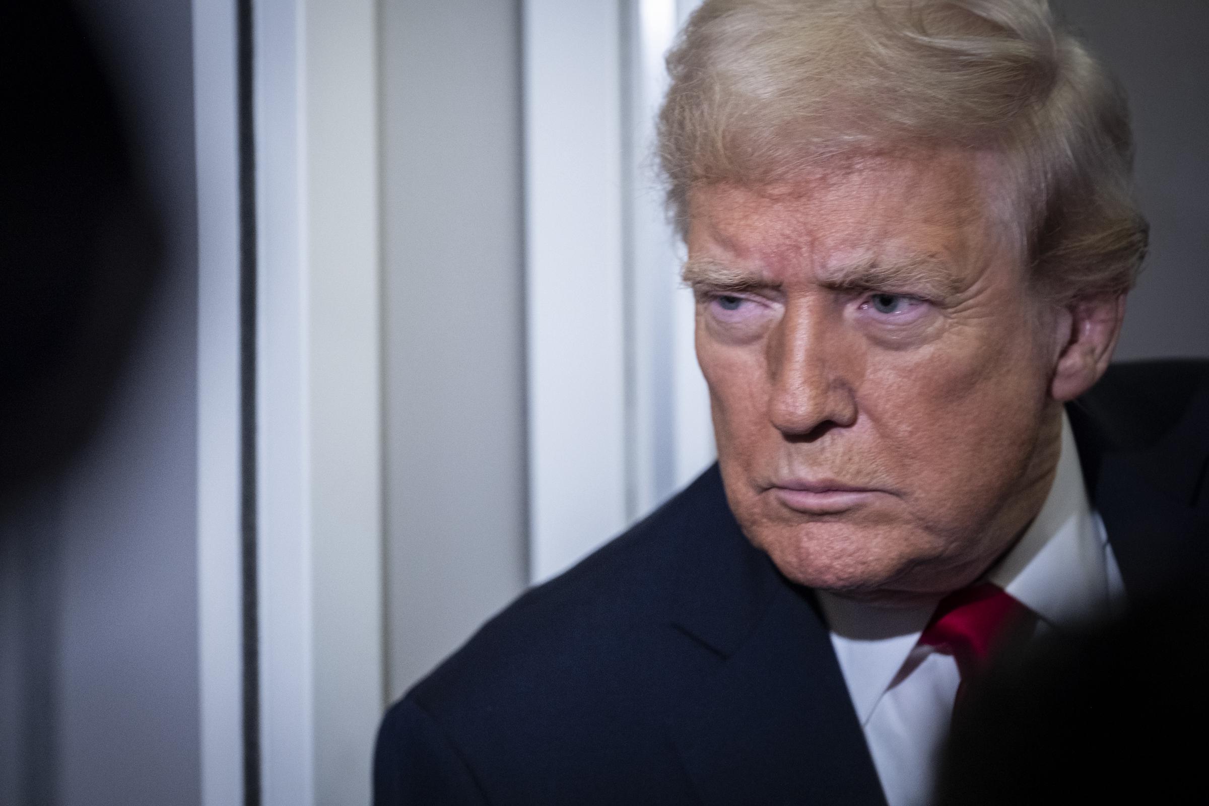 President Donald Trump speaks to the media aboard Air Force One while traveling to Florida for Thanksgiving on November 25, 2025 | Source: Getty Images