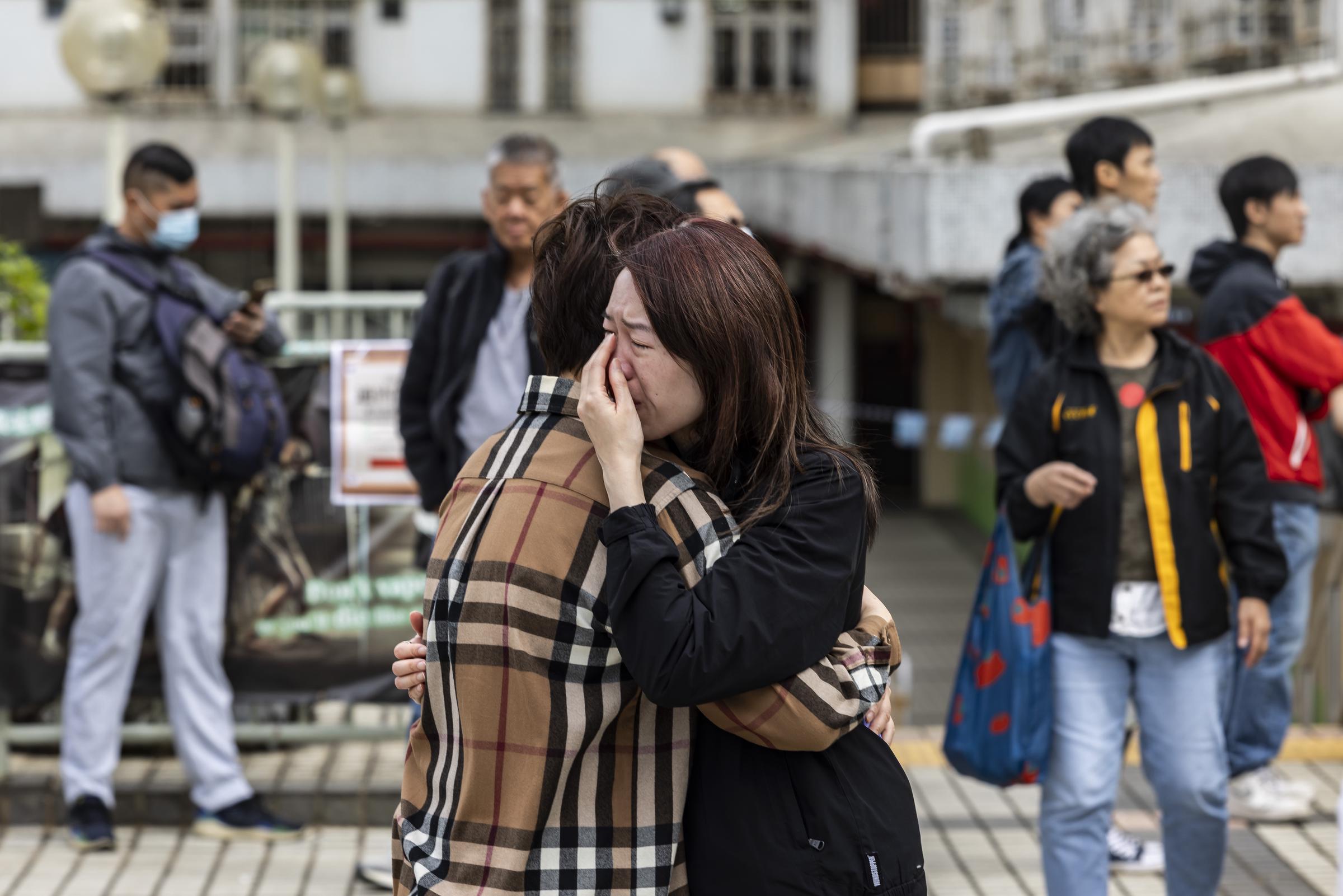 A woman breaks down in tears near Wang Fuk Court as the community reels from the deadly blaze on November 27, 2025 | Source: Getty Images