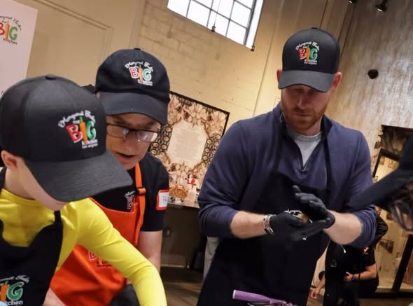 Harry, Meghan, and Archie seen volunteering at Our Big Kitchen Los Angeles on November 26, 2025 | Source: Facebook/extra
