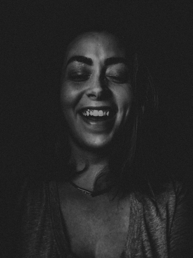 A woman laughing | Source: Unsplash