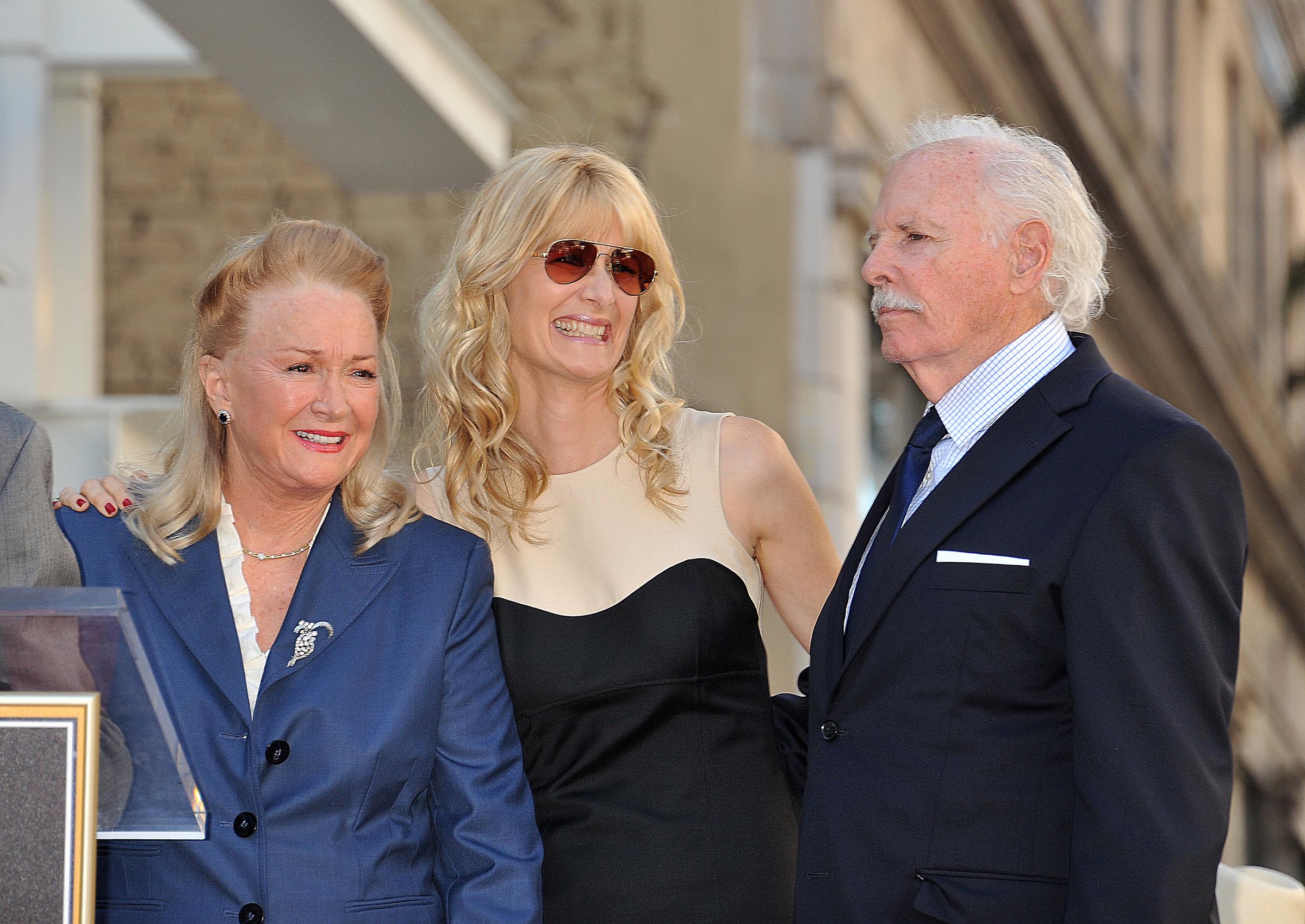 Diane Ladd, Bruce Dern, and Laura Dern pose together after receiving their Stars on the Hollywood Walk of Fame on Hollywood Blvd | Source: Getty Images