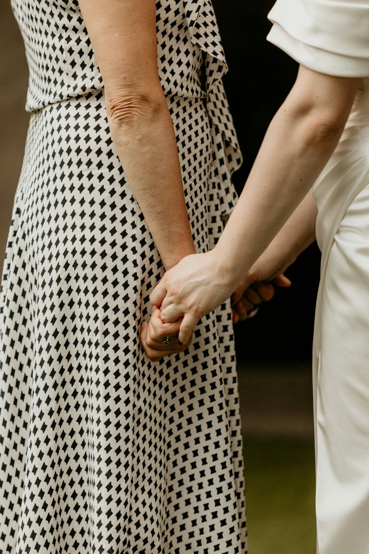 Two women holding hands | Source: Unsplash