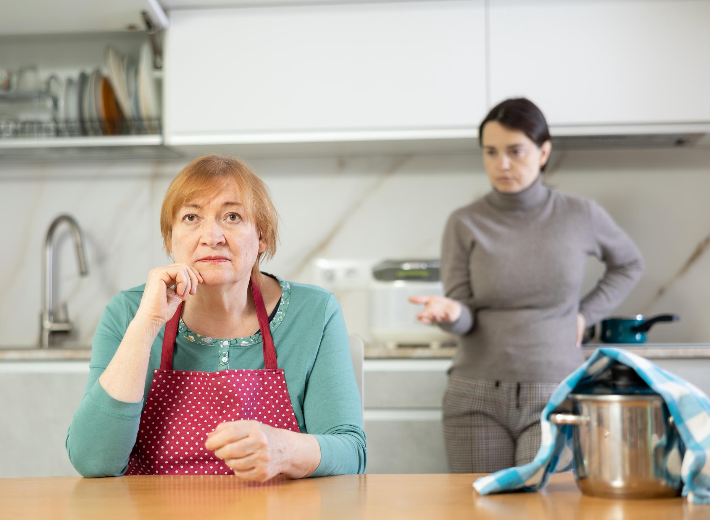 Frustrated elderly mother having a tense conversation with her daughter | Source: Shutterstock