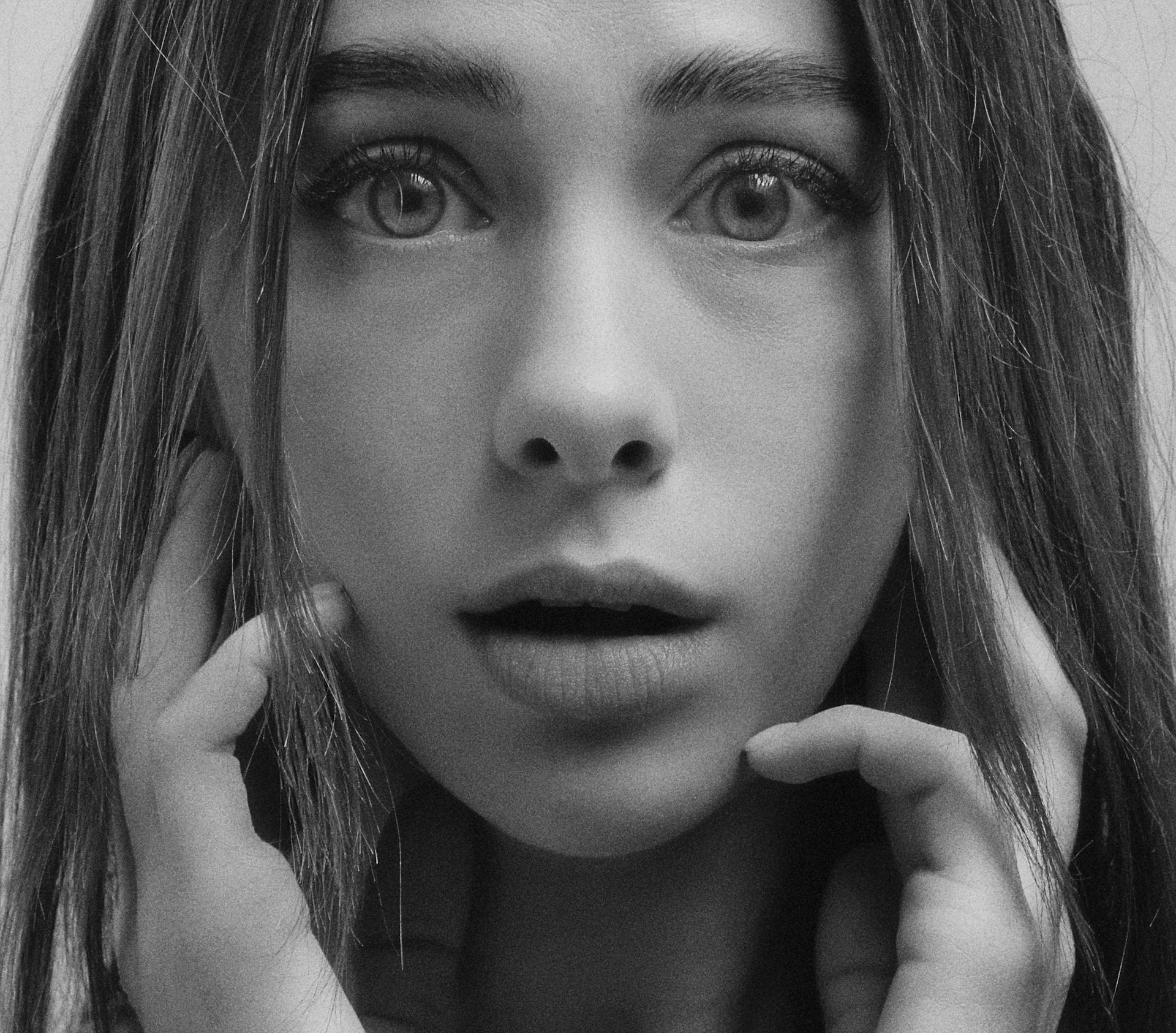 A grayscale shot of a shocked woman | Source: Pexels