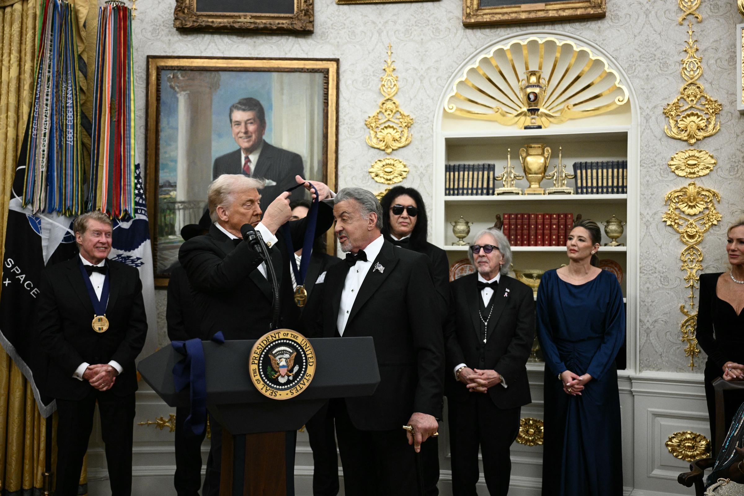 Kennedy Centre Honors recipient Sylvester Stallone receives a medal from Donald Trump during the Kennedy Centre Honors medal presentation on December 6, 2025 | Source: Getty Images