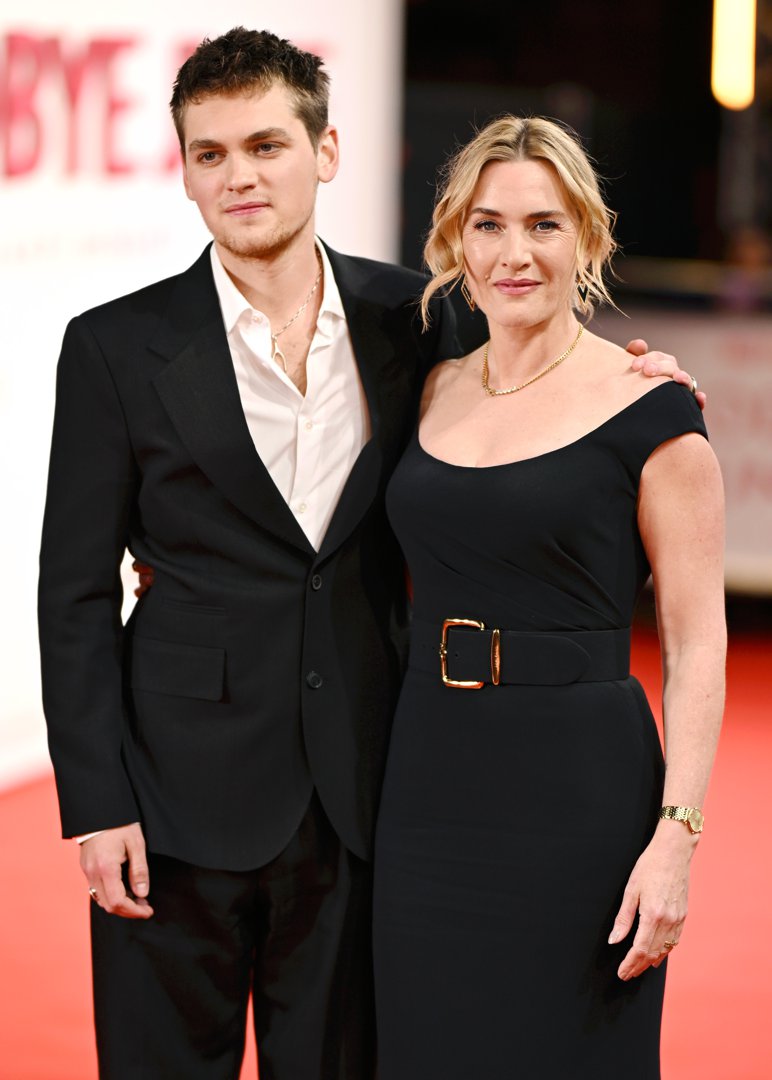Standing side by side under the bright premiere lights, Winslet and Anders posed for photographers with calm confidence. The actress, in a sleek belted black gown, and Anders, in a tailored dark suit and open-collared shirt, looked every bit the poised creative team behind 