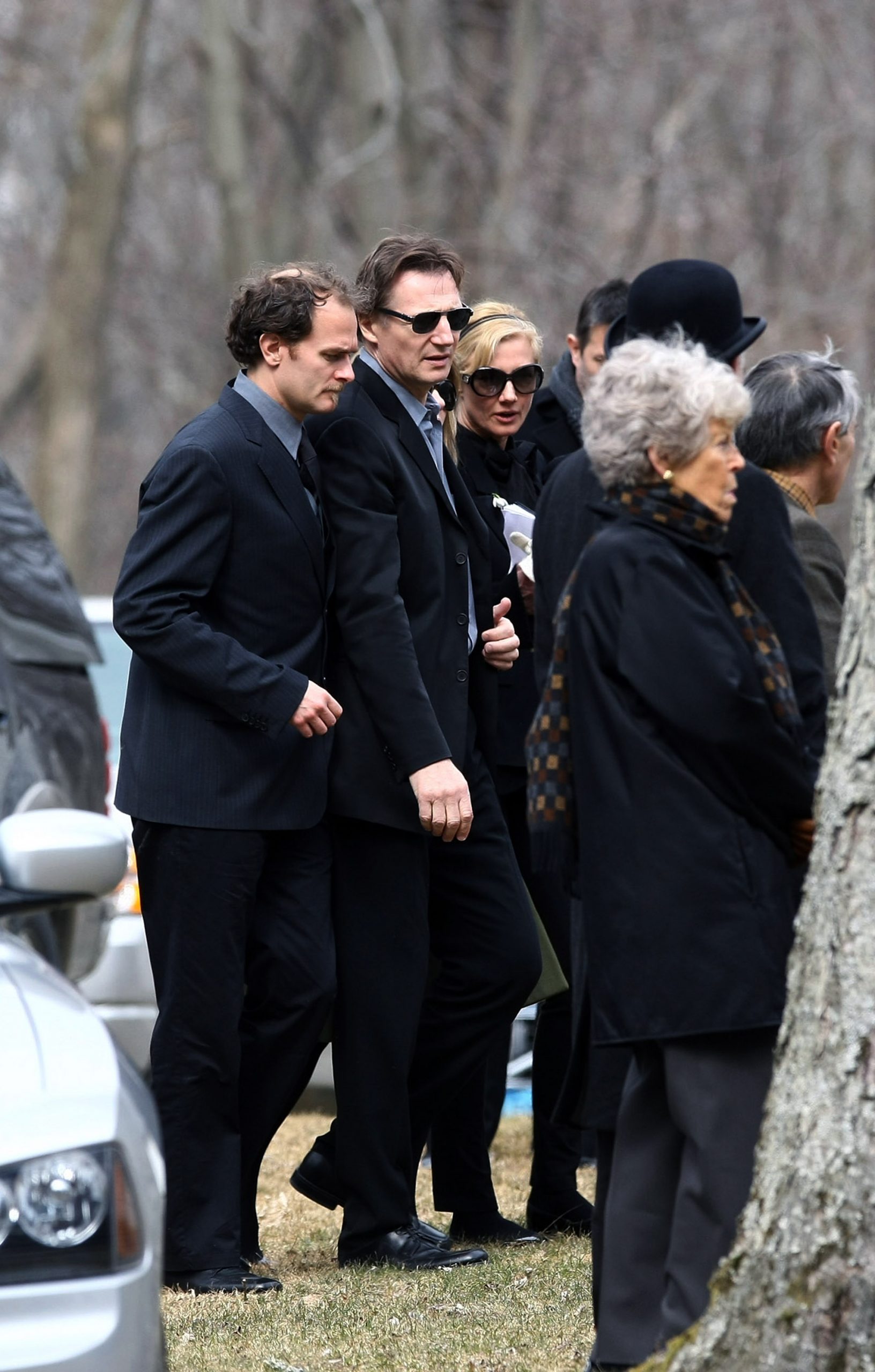 Liam Neeson (C) with friends and family arrive for the funeral of actress Natasha Richardson at St. Peter's Lithgow Episcopal Church on 22 March 2009 in Lithgow, New York. | Source: Getty Images