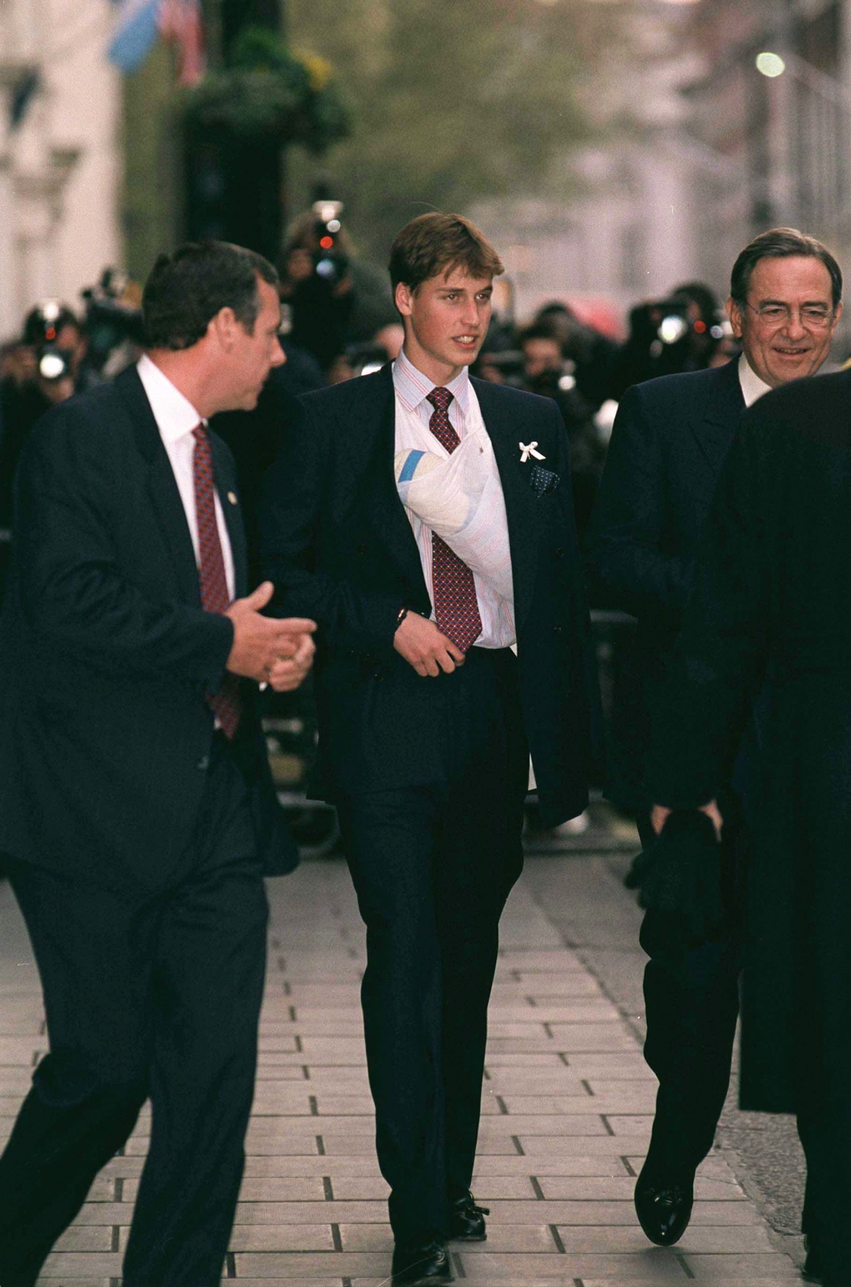 William, Prince of Wales, arrived at the Greek Cathedral of Saint Sophia in London wearing a sling after a sporting injury, drawing attention from the press as he joined other royals for the christening of his godson, Prince Constantine-Alexios of Greece.