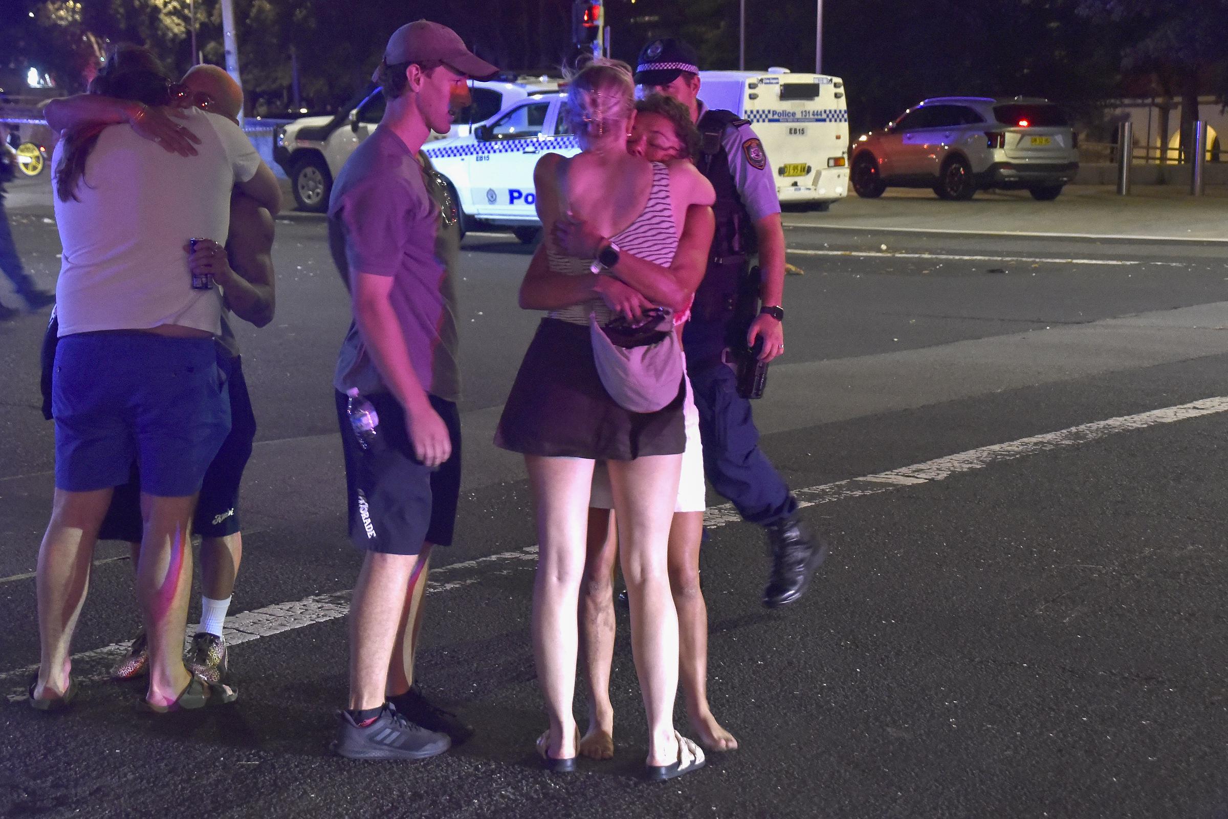 Shaken by the chaos, people embraced and consoled one another in the aftermath of the Bondi Beach shooting on December 14, 2025. The emotional toll of the attack &mdash; which struck during a family Hanukkah celebration &mdash; left bystanders traumatised as emergency services secured the area.