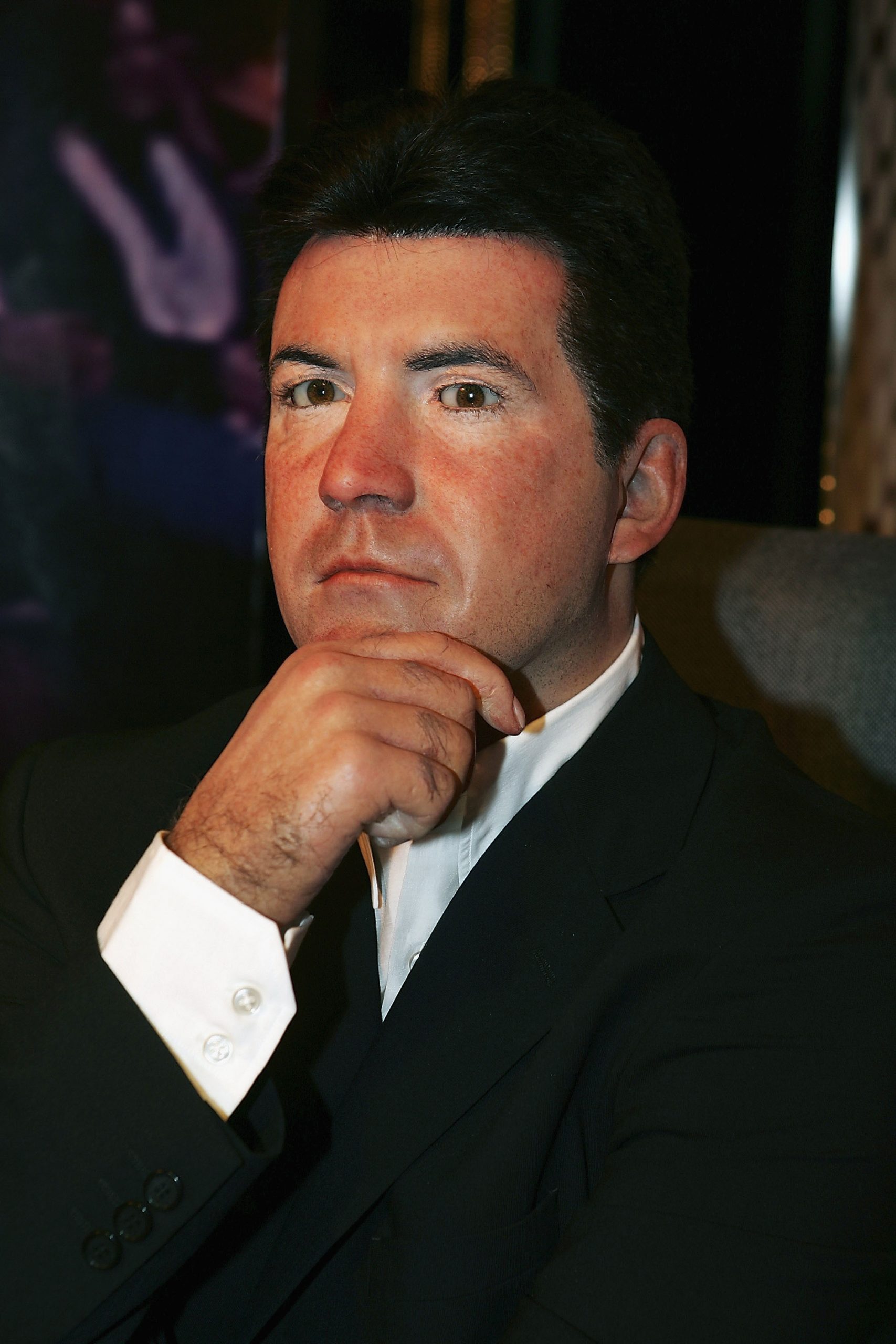 Captured in 2005 at Madame Tussauds London, Cowell strikes a famously icy pose, chin in hand, perfectly channeling the no-nonsense persona that had viewers &mdash; and contestants &mdash; trembling across two continents.