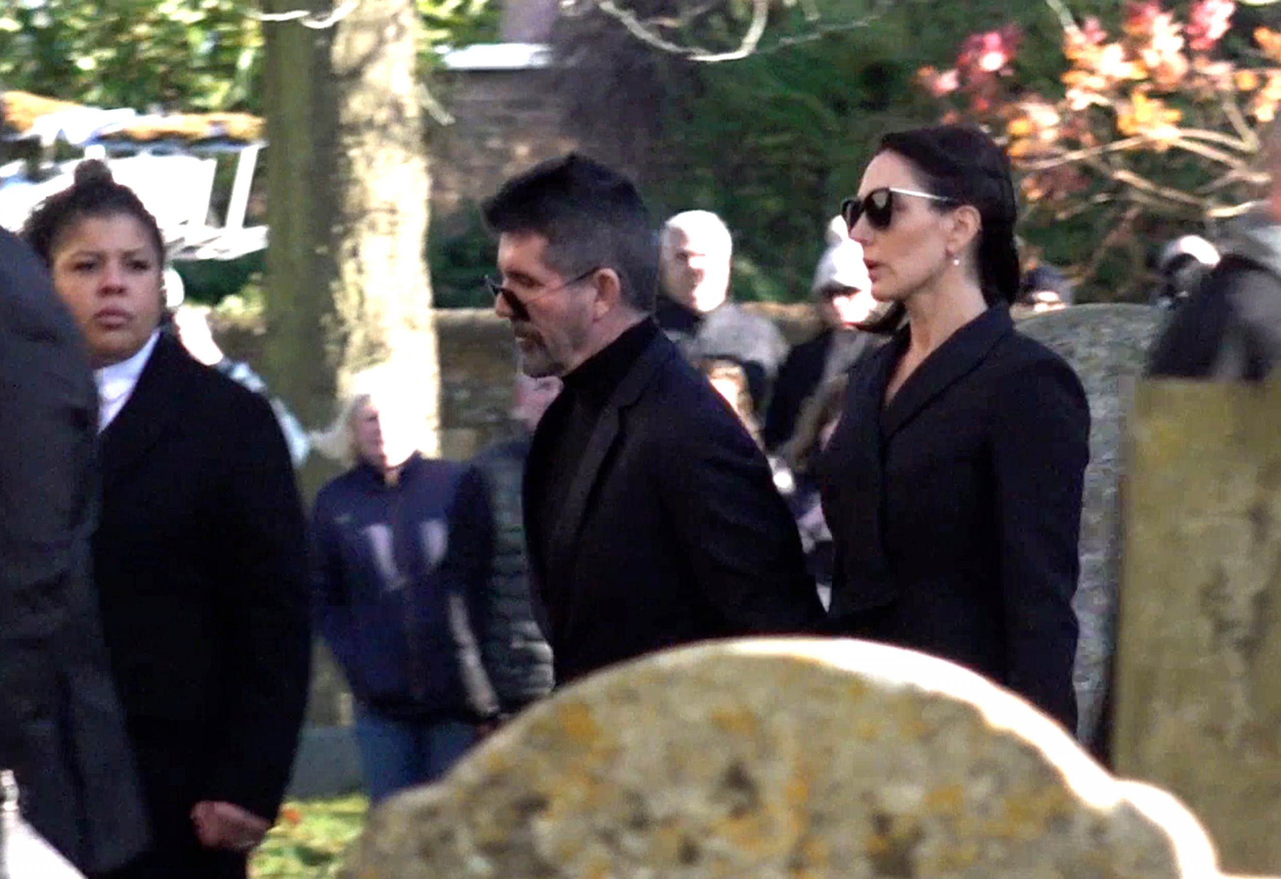 Cowell arrives in solemn black in November 2024, joined by fianc&eacute;e Lauren Silverman for the funeral of Liam Payne. At St Mary's Church in Amersham, he stands in quiet reflection, mourning the loss of one of pop's brightest voices.