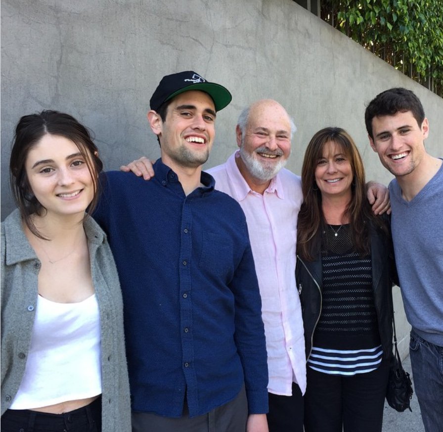 Jake Reiner standing closely with his parents and siblings outdoors against a plain wall, from a post dated March 3, 2015. | Source: Instagram/michelereiner