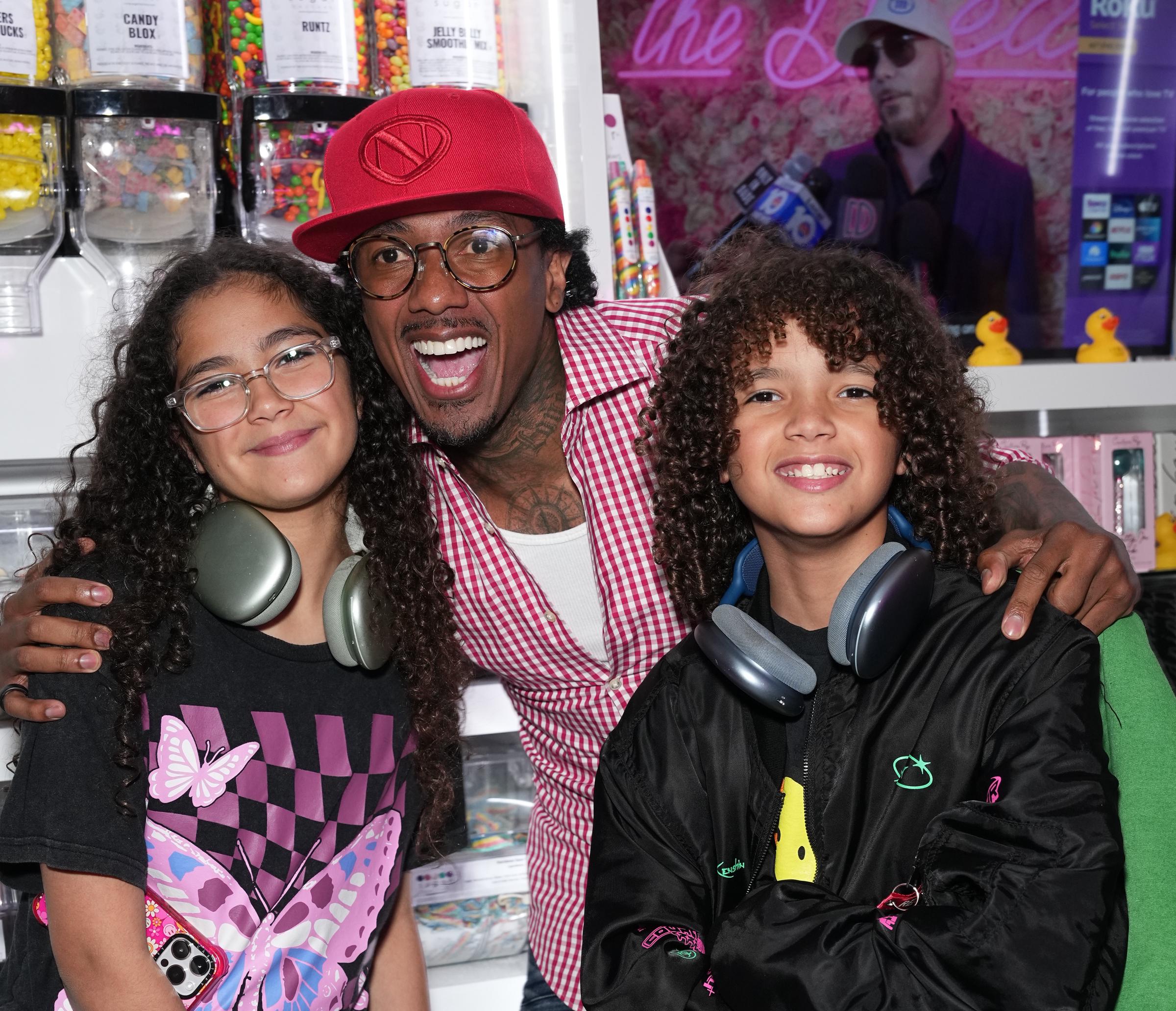 Nick Cannon with Monroe and Moroccan Cannon at Sugar Factory in New York City on August 11, 2023 | Source: Getty Images
