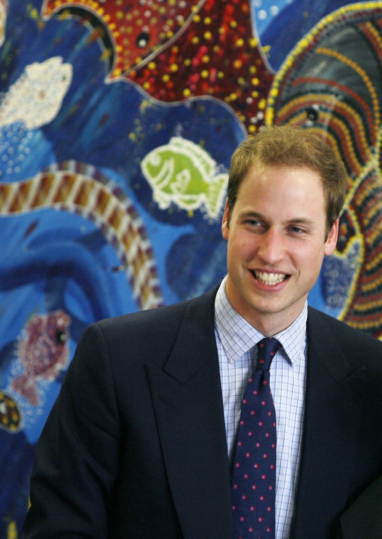 Prince William flashes a warm smile as he connects with Aboriginal elders at the Redfern Community Centre in Sydney on 19 January 2010. Engaged and at ease, the royal discusses Indigenous culture and social progress in a heartfelt moment of unity.