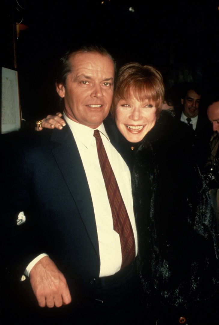 Old friends, lasting legends &mdash; Jack Nicholson and MacLaine share a laugh in New York City, circa 1984. Linked arm in arm, the off-screen camaraderie between these two titans of cinema radiates through this relaxed, heartfelt moment.