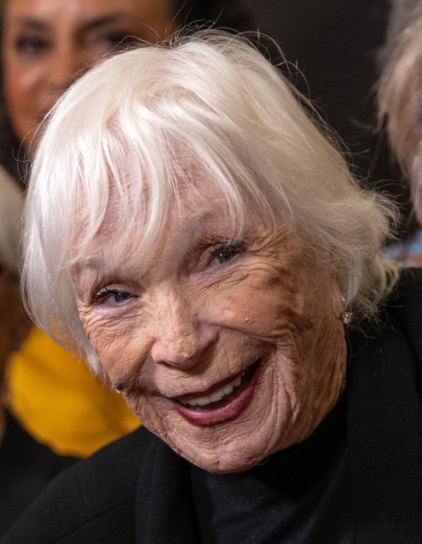 With her signature sparkle and expressive gaze, MacLaine glows at the 2025 Dance Hall of Fame Ceremony. Her heartfelt smile, framed in a tender close-up, reflects a lifelong love for performance &mdash; and a legacy that refuses to fade.
