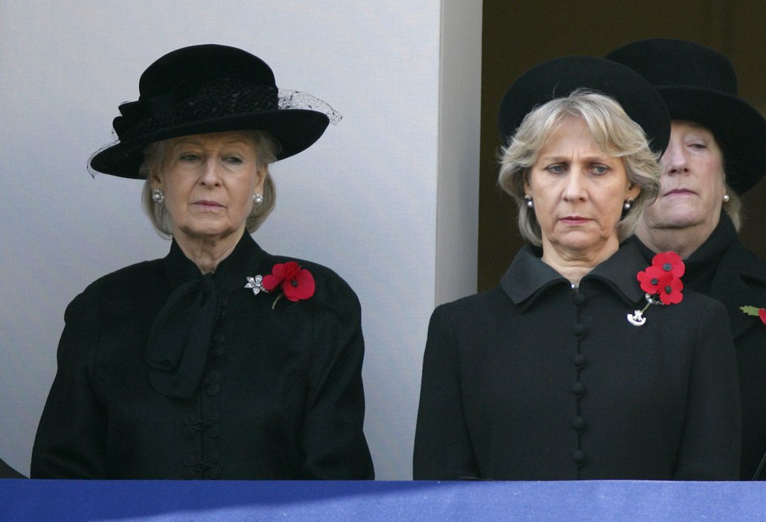 Standing side by side with the Duchess of Gloucester, Princess Alexandra observes Remembrance Day at the Cenotaph on 13 November 2011. Dressed in solemn black and adorned with red poppies, she honors the fallen with grace, silence, and deep reflection.