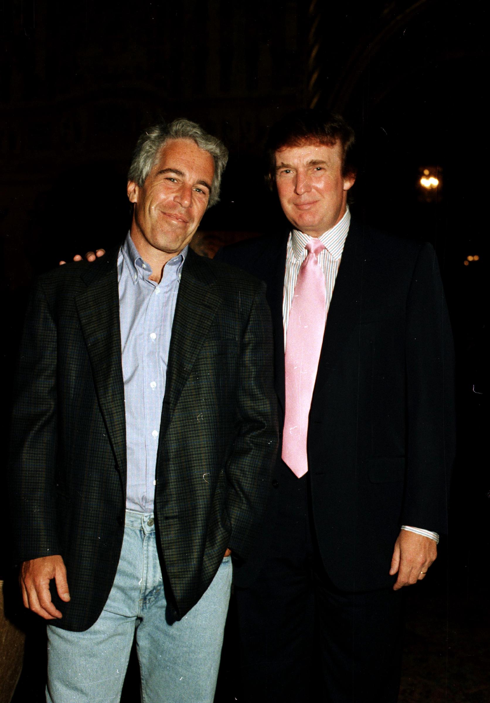 Jeffrey Epstein (left) and real estate developer Donald Trump as they pose together at the Mar-a-Lago estate on 22 February 1997 in Palm Beach, Florida. | Source: Getty Images